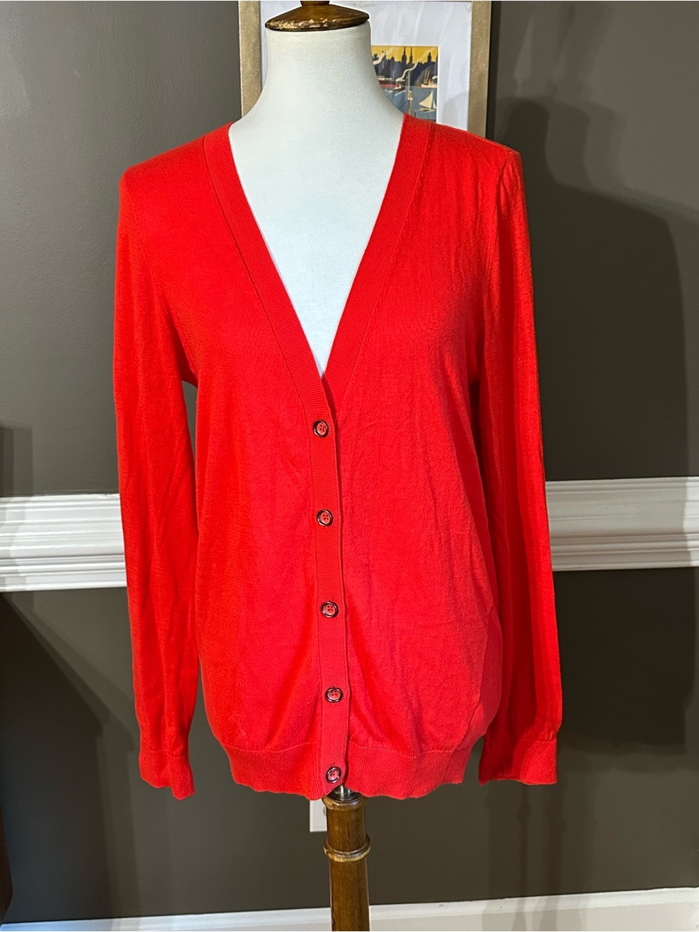 CAbi Bright Red V-Neck Button Cardigan with back zipper styling.
